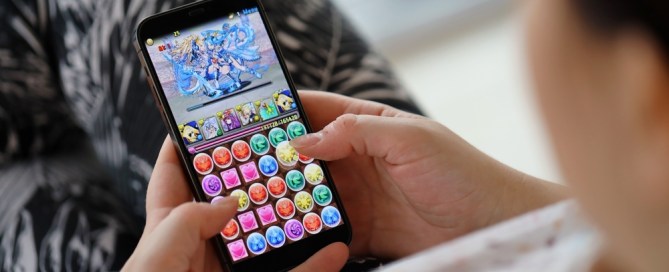 Overhead photo of a person playing a puzzle-type video game.